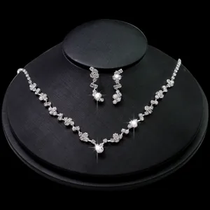 Stunning rhinestone bridal necklace and matching tassel earrings jewelry set for wedding party.