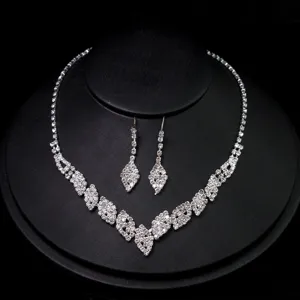 Rhinestone bridal necklace earrings set detail, sparkling crystal jewelry for wedding party.