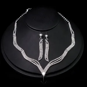 Silver rhinestone bridal necklace and matching earrings jewelry set for special wedding parties.
