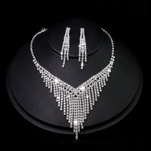 Bridal rhinestone tassel necklace and earrings set, sparkly crystal jewelry for wedding party.