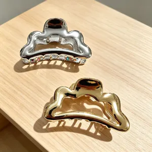 Gold and silver metal hair claw clips, irregular wavy design shark clips for styling hair.