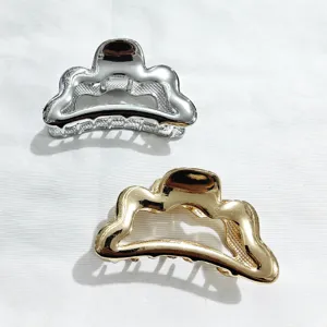 Metal hair claw clip set in silver and gold, trendy geometric design for chic hairstyles.