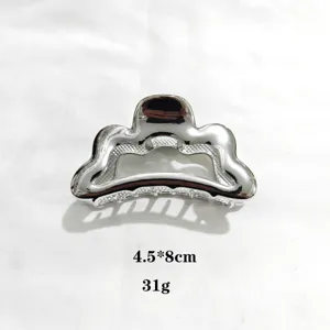 Silver metallic hair claw clip with unique wavy design, elegant hair accessory for women. 8cm