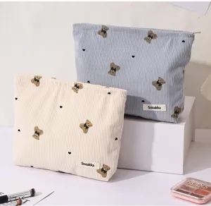 Corduroy makeup bag with cute bear pattern, large capacity portable cosmetic pouch for travel.