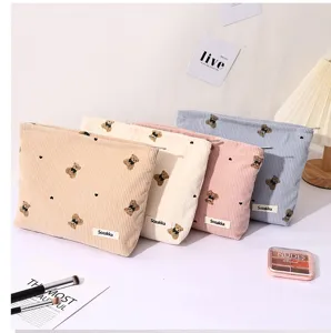 Corduroy bear cosmetic bag detail view, multi-color cute makeup pouch with zipper closure.