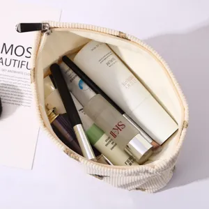 Corduroy cosmetic bag with cute bear embroidery, large capacity portable makeup organizer.