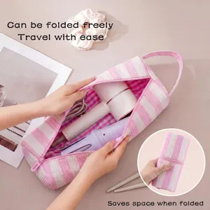 Borsa porta asciugacapelli a righe rosa, pratico organizzatore da viaggio pieghevole per accessori.