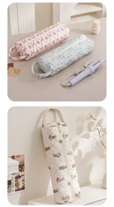 Vista dettagliata della borsa trapuntata per accessori capelli con comoda forma cilindrica e zip.