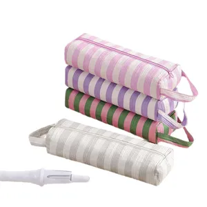 Borsa a righe per strumenti per capelli, custodia da viaggio per piastra e ferro arricciacapelli.