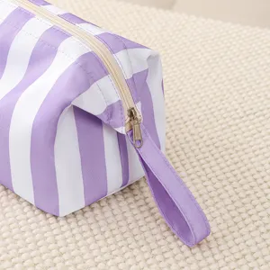 Purple white striped storage bag portable zipper cosmetic organizer travel pouch main view