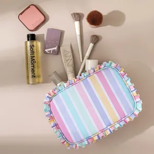 Pastel striped cosmetic bag with cute ruffled edge, large capacity travel portable makeup storage pouch.
