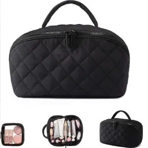 Black quilted travel cosmetic bag with handle, large capacity makeup storage organizer.