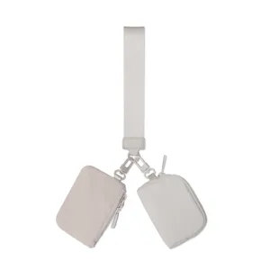 Minimalist nylon multi-pouch keychain set with mini coin purses and wrist strap for daily use.