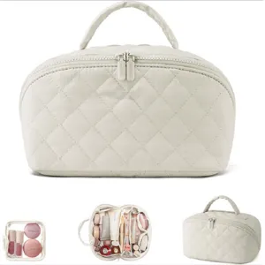 Quilted cosmetic bag large capacity portable travel makeup organizer storage bag with handle.