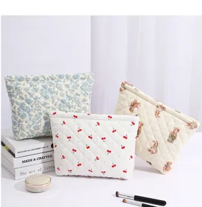 Quilted cosmetic bag with floral and bear print, large capacity zipper storage pouch.