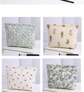 Quilted cosmetic bag featuring floral, bear and cherry prints, large capacity with zipper closure.