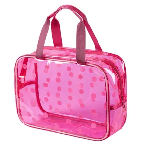 Pink polka dot transparent waterproof toiletry bag large capacity travel cosmetic organizer.