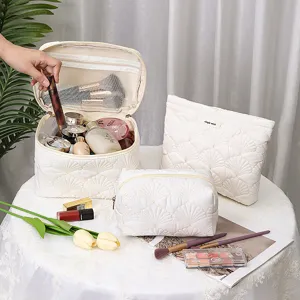 Quilted shell cosmetic bag set, large capacity portable makeup organizer for travel and daily use.