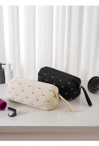Quilted hair dryer storage bag with cute bow embroidery, portable travel cosmetic organizer pouch.