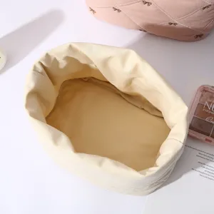 Cute bow canvas cosmetic bag, large capacity portable storage pouch for travel daily use.