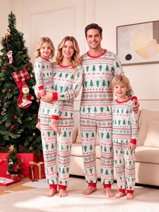 Detail view of family Christmas knit pyjamas set featuring festive tree and geometric print.
