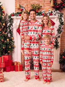 Cozy family matching Christmas pajama detail shot featuring festive red and green reindeer pattern.