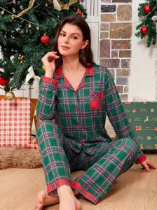Cozy green red plaid pajama set detail, comfortable long sleeve sleepwear in holiday scene.