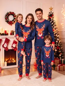 Cozy family matching Christmas pajamas featuring cute reindeer print and festive blue and red design.