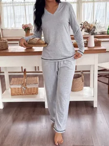 Grey V-neck long sleeve pajama set for women, cozy loose loungewear detail view shot.