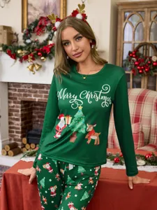 Green Christmas pajamas set for women with long sleeves and holiday graphic print details.