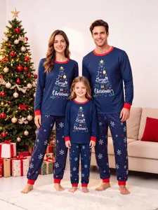 Family matching Christmas pajamas detail showing tree graphic print and holiday sleepwear set.