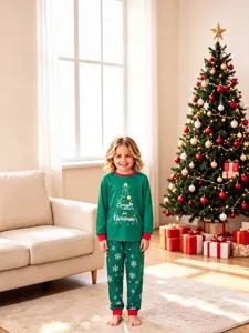 Cozy kids Christmas pajama set featuring green tree print and festive holiday details.