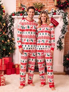Cozy matching Christmas couple pajamas featuring festive reindeer and tree holiday prints.
