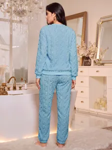 Back detail of light blue coral fleece plush loungewear set with cozy cable knit texture.