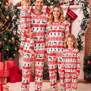 Christmas matching family pajamas set featuring festive reindeer and tree print for holiday.