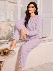 Detailed view of cozy women's plush coral fleece loungewear set in soft lavender, ideal for winter.