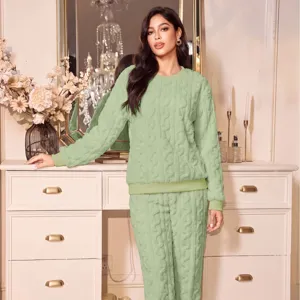 Cozy green fleece loungewear set for women, warm winter long sleeve top and pants.