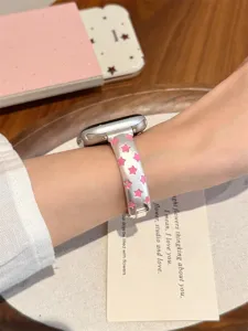 Vue de detail du bracelet de montre en metal elegant avec etoiles roses pour Apple Watch.