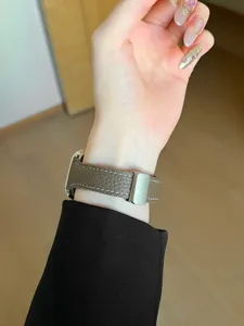 Narrow brown leather watch strap with white stitching, elegant slim replacement band for watch