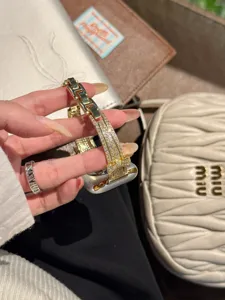 Rhinestone bow metal watch strap compatible with Apple Watch luxury sparkly replacement band.
