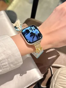 Sparkling rhinestone bow watch band compatible with Apple Watch, elegant metal accessory strap.