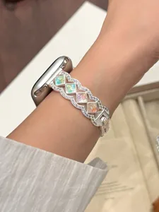 Metal watch strap with colorful stones and wave design, compatible with Apple Watch.