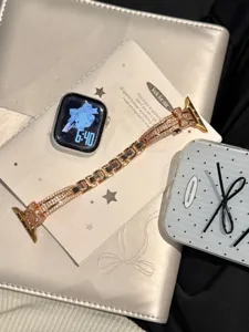 Rose gold rhinestone watch strap with bow, luxury metal replacement band for Apple Watch.