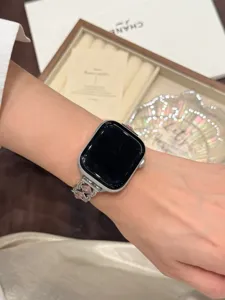 Metal watch strap compatible with Apple Watch, featuring elegant stone design for luxury look.