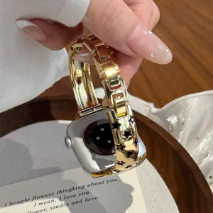 Bracelet de montre en métal étoile compatible avec Apple Watch, design élégant et chic.