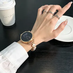 Detailed view of metal four-leaf clover watch strap, elegant design for smartwatches.