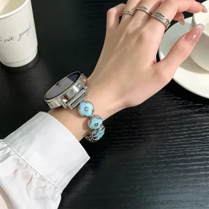 Metal epoxy clover watch strap compatible with smartwatch, stylish blue floral links accessory.