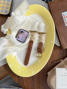 Bracelet de montre en cuir véritable avec breloques étoiles strass pour Apple Watch brun.