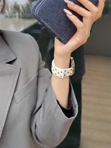 Stylish white silicone watch band with black heart pattern, versatile smartwatch accessory.
