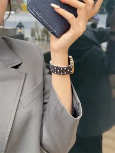 Silicone watch band with cute white hearts pattern, versatile replacement strap for smartwatches.
